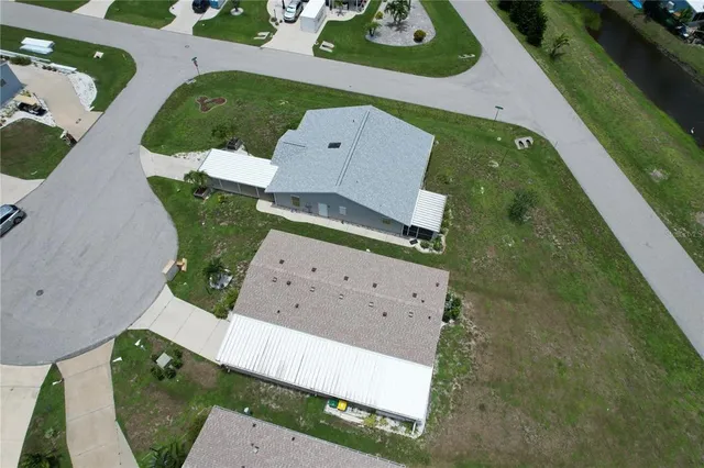 a living room with lots of furniture and a chandelier