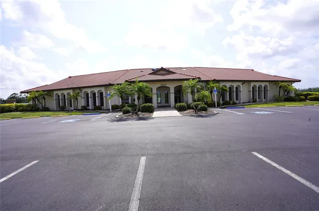 a view of a swimming pool with a patio and a yard