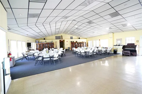 a view of a swimming pool with a table and chairs