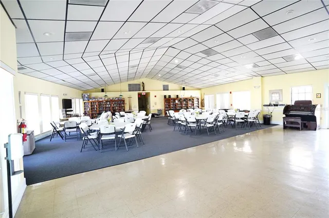 a view of a swimming pool with a table and chairs