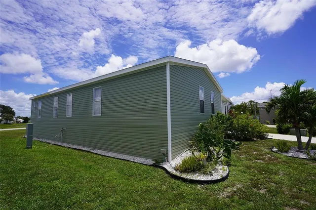 a dining room with furniture and a chandelier