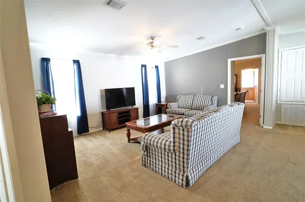 a living room with furniture and a couch