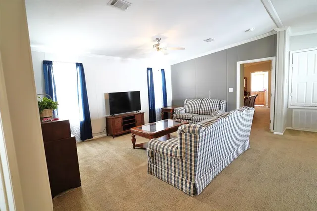 a living room with furniture and a couch