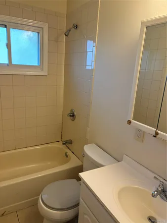 a bathroom with a sink a toilet and a bathtub