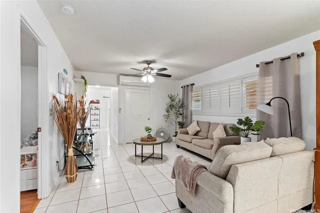 a living room with furniture and white walls