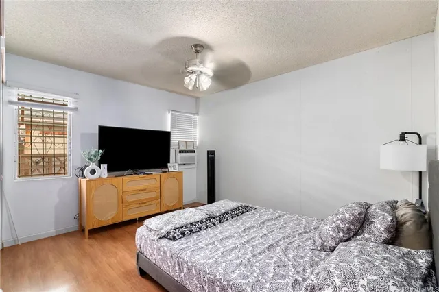 a bedroom with bed and tv