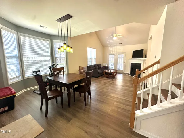 a view of a dining room with furniture and window