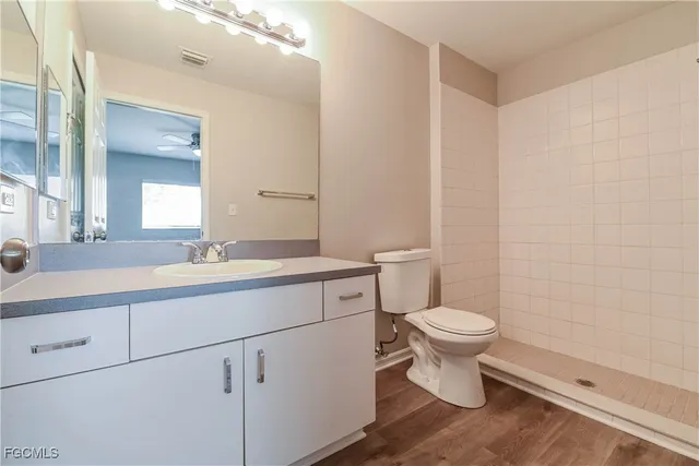 a bathroom with a sink toilet and a mirror