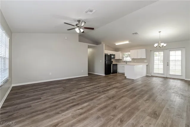 a view of a kitchen with a sink and a window