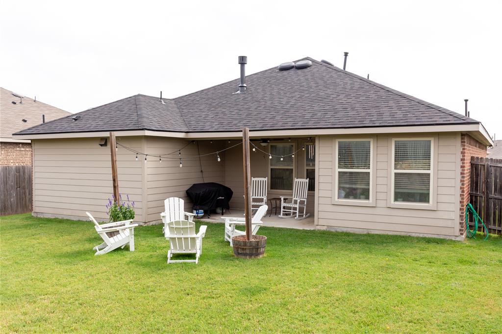 14525 Serrano Ridge Road Fort Worth, TX 76052 - Photo 11 of 12 Large backyard with covered patio