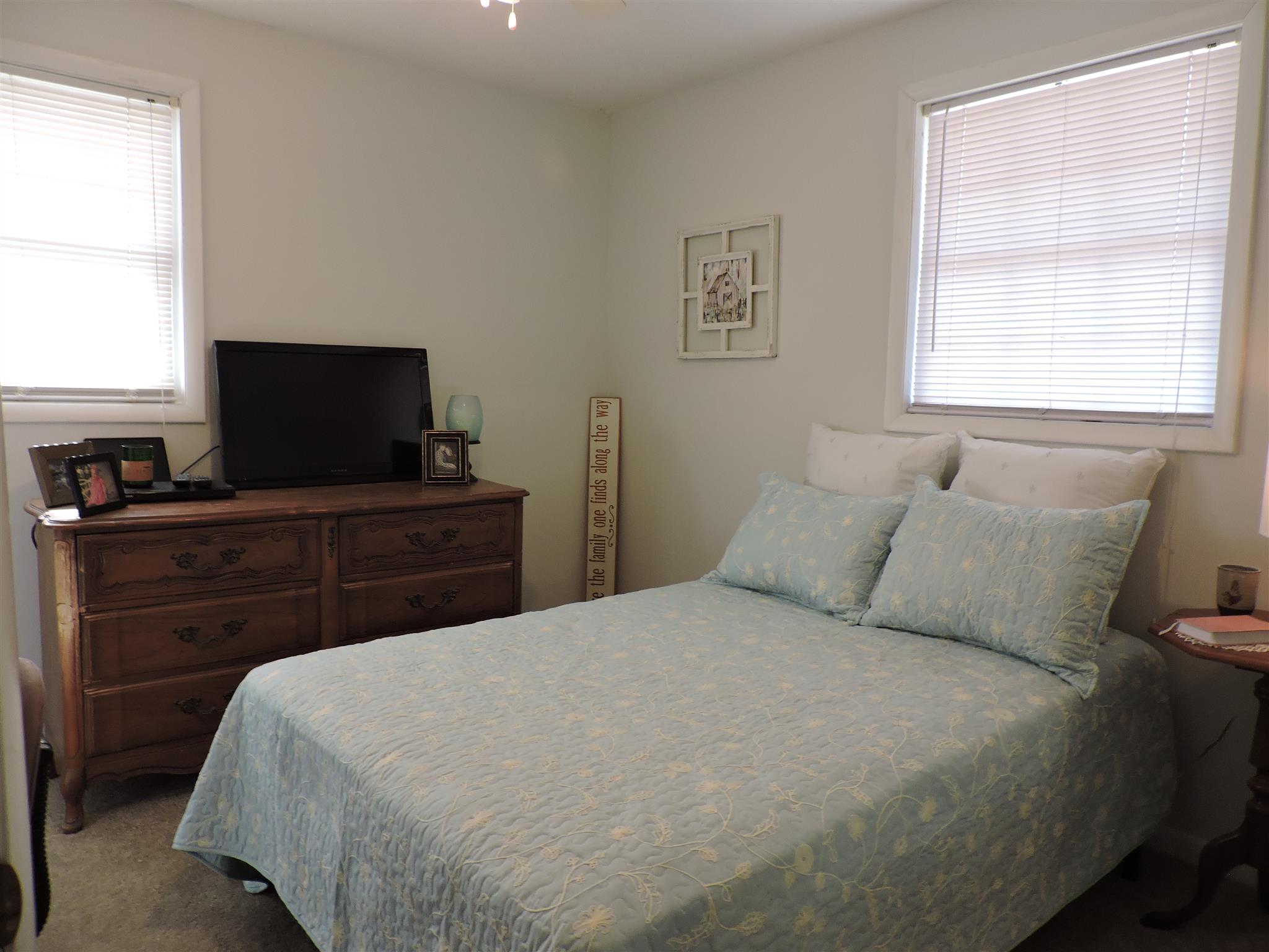 2222 Cooks Road Mount Juliet, TN 37122 - Photo 4 of 9 a bedroom with a bed and a flat screen tv