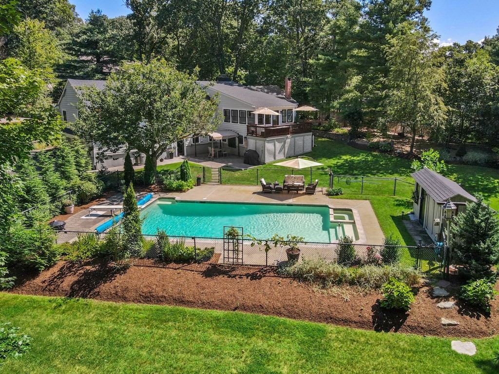 39 Bradyll Road Weston, MA 02493 - Photo 5 of 11 a view of a house with a yard and sitting area