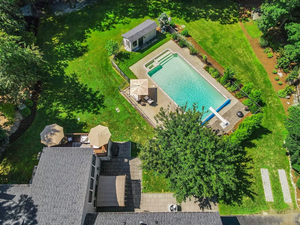 39 Bradyll Road Weston, MA 02493 - Photo 6 of 11 an aerial view of a house with outdoor space