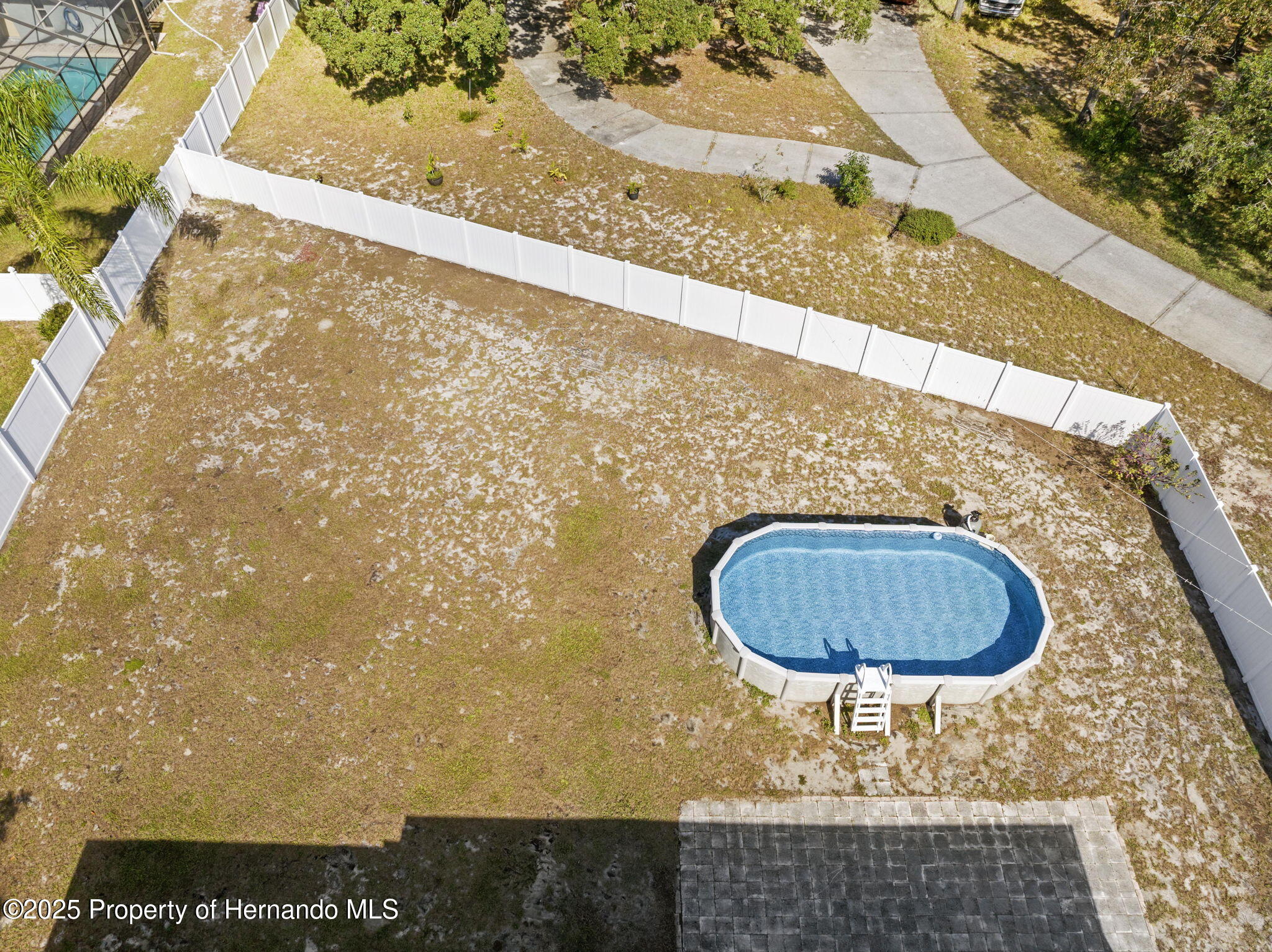 7319 Lagoon Road Spring Hill, FL 34606 - Photo 30 of 60 8-web-or-mls-DJI_20251015034835_0022_D