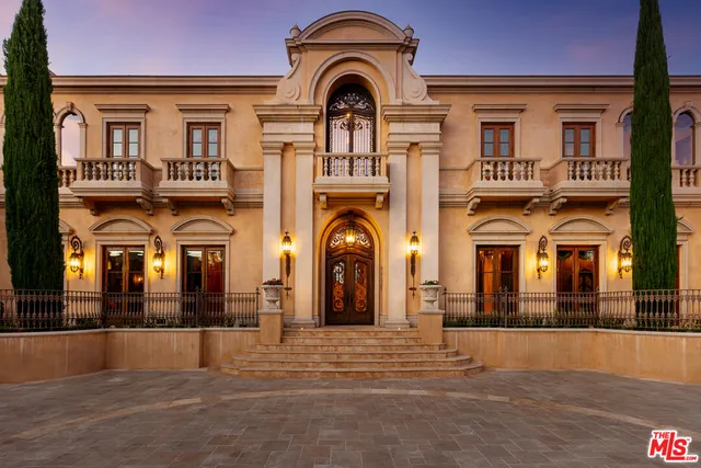 a view of a brick house with a large windows