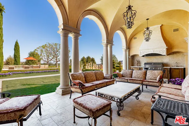 a view of a chairs and table in the patio
