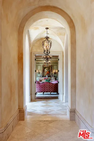 a view of a hallway view with a chandelier and livingroom view