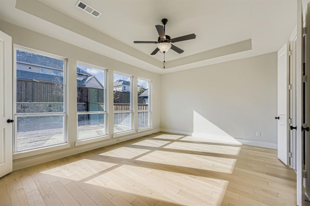 4446 Timberdrift Street Midlothian, TX 76065 - Photo 16 of 28 a bedroom with a bed and a large window