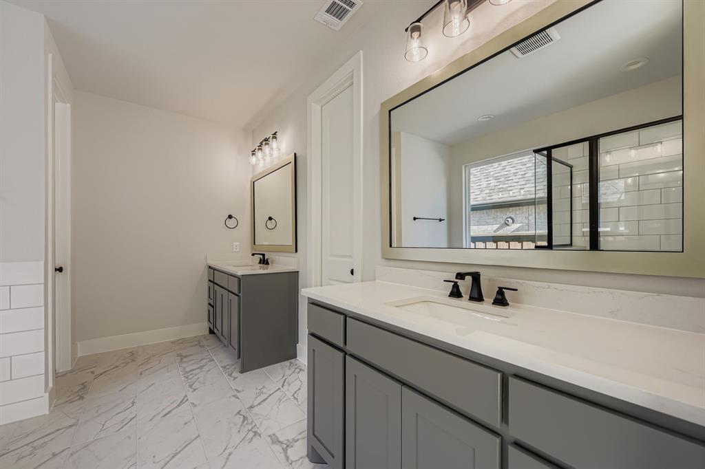 4446 Timberdrift Street Midlothian, TX 76065 - Photo 19 of 28 a bathroom with a sink and a mirror