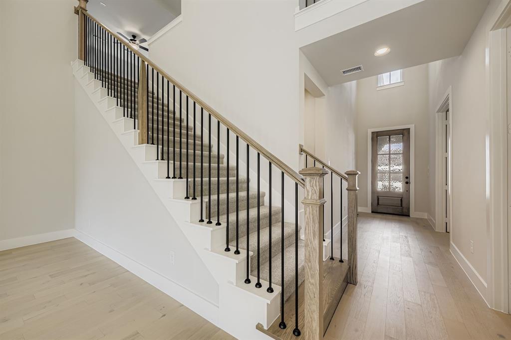 4446 Timberdrift Street Midlothian, TX 76065 - Photo 4 of 28 a view of staircase with railing and white walls
