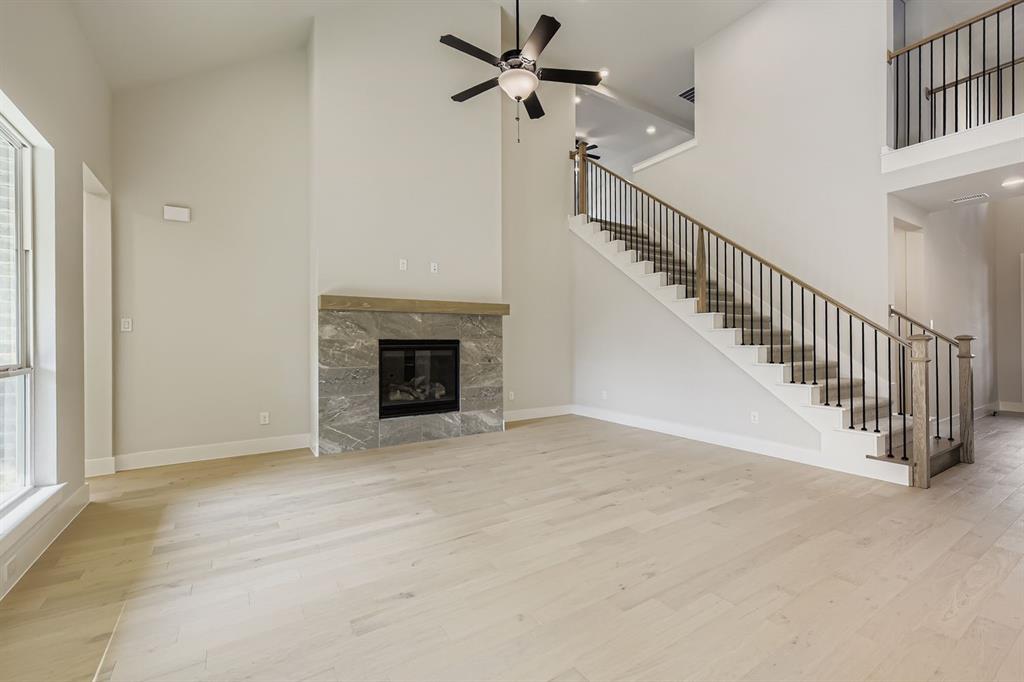 4446 Timberdrift Street Midlothian, TX 76065 - Photo 6 of 28 a view of empty room with fireplace and fan