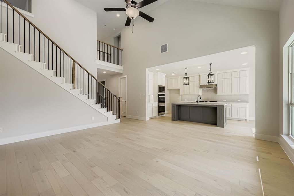 4446 Timberdrift Street Midlothian, TX 76065 - Photo 7 of 28 a view of kitchen with cabinets and wooden floor