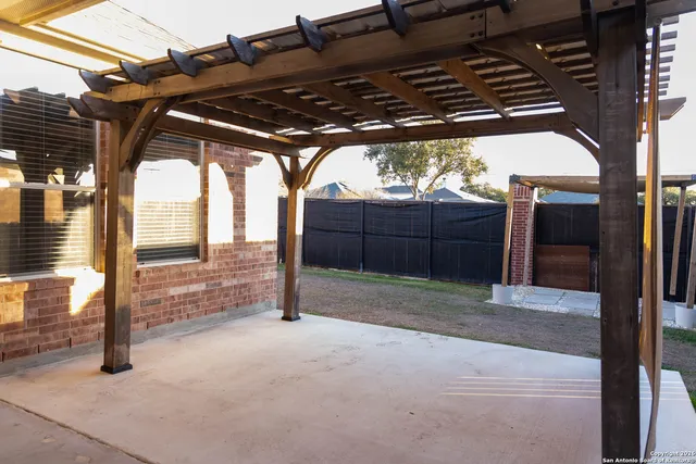 a view of backyard with small cabin