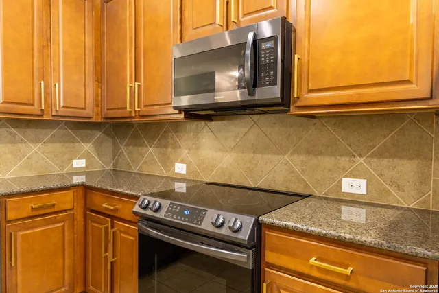 a view of a storage and utility room with washer and dryer