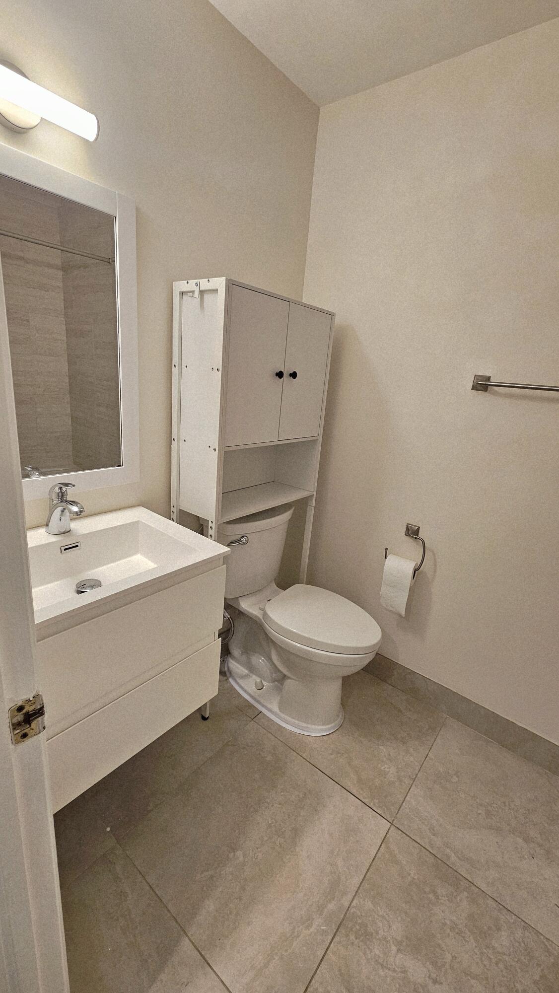 6560 Via Regina Boca Raton, FL 33433 - Photo 13 of 15 a bathroom with a sink a toilet and shower