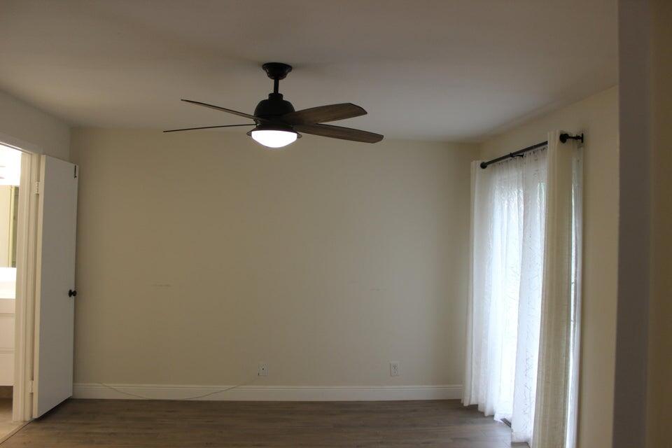6560 Via Regina Boca Raton, FL 33433 - Photo 6 of 15 a view of empty room with window
