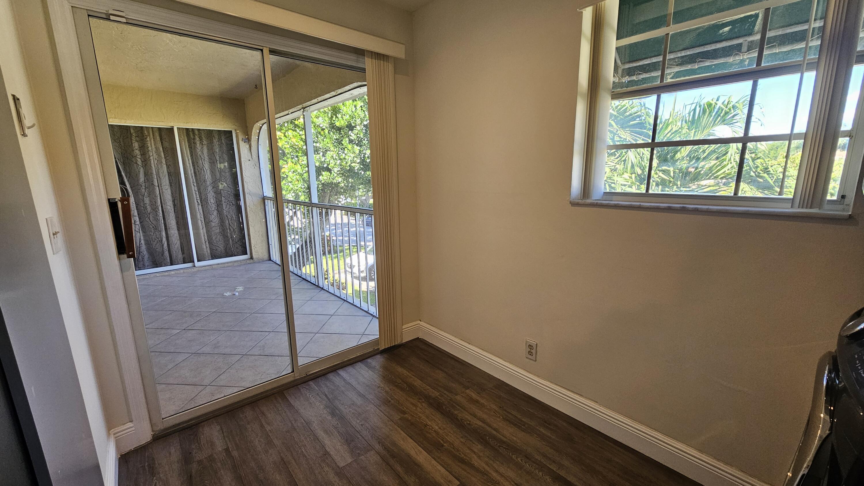 6560 Via Regina Boca Raton, FL 33433 - Photo 10 of 15 a view of outdoor space with wooden floor and windows