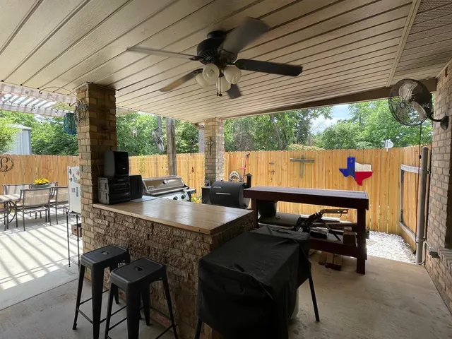 a table and chairs in front of a house