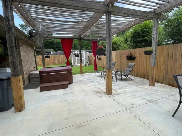 a view of a backyard with table and chairs