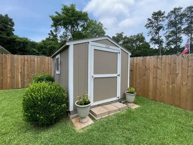 a front view of a house with brick walls