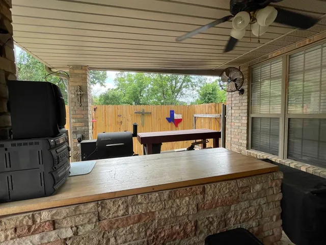 a dining room with a table and chairs