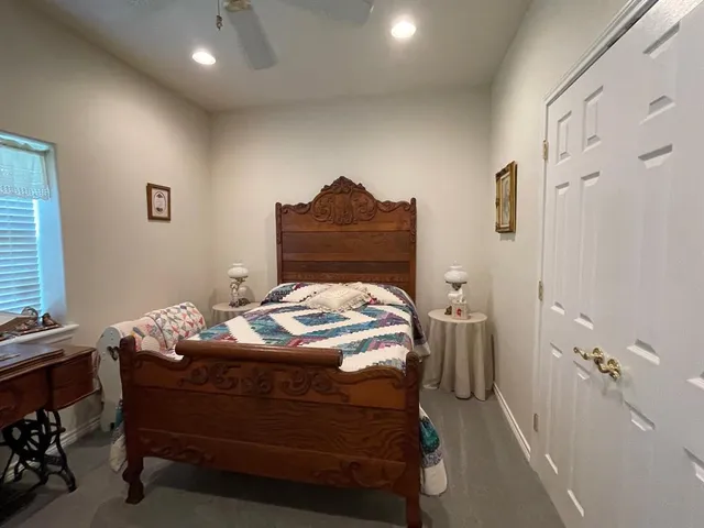 a bedroom with a bed and furniture