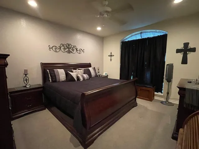 a bedroom with a bed and a walk in closet