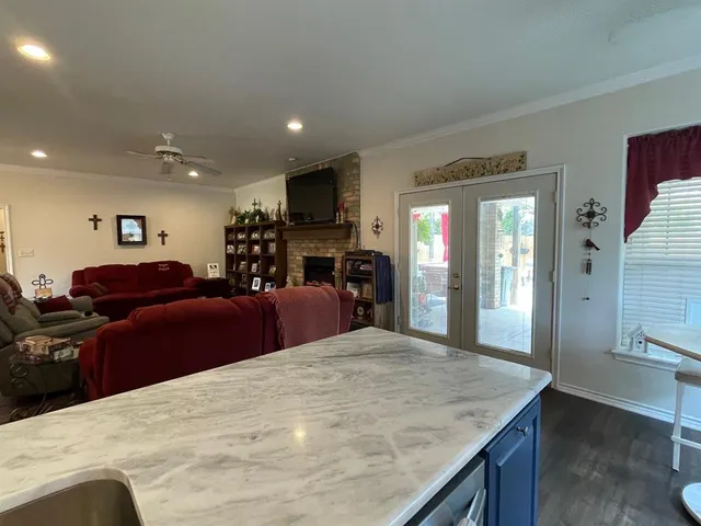 a large bedroom with bed and a large mirror