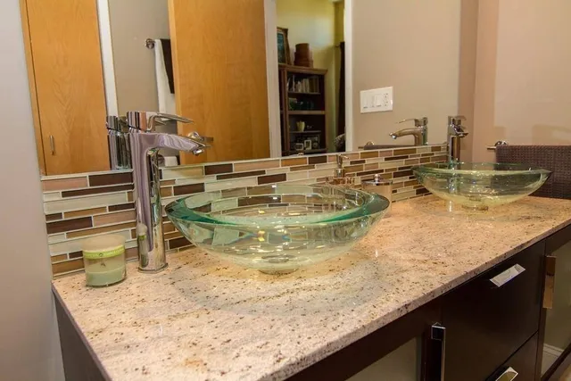 a view of a swimming pool with chairs