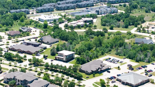 an aerial view of a house with a lake view
