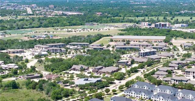 an aerial view of a house having yard