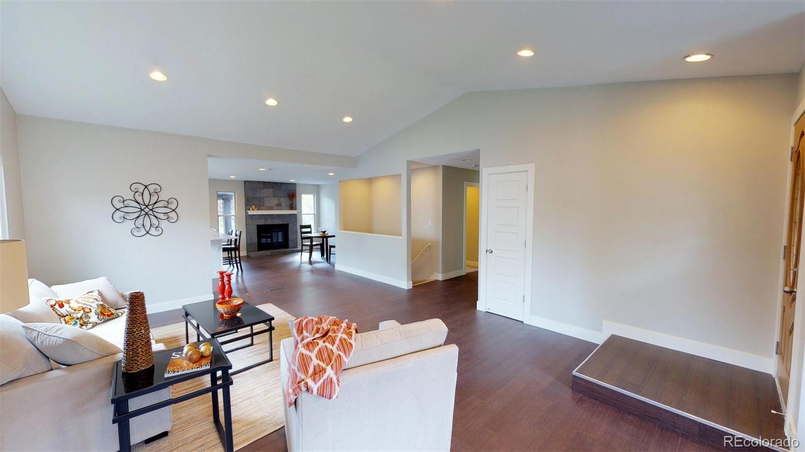 530 Prairie Ridge Road Highlands Ranch, CO 80126 - Photo 1 of 18 a living room with furniture and a table