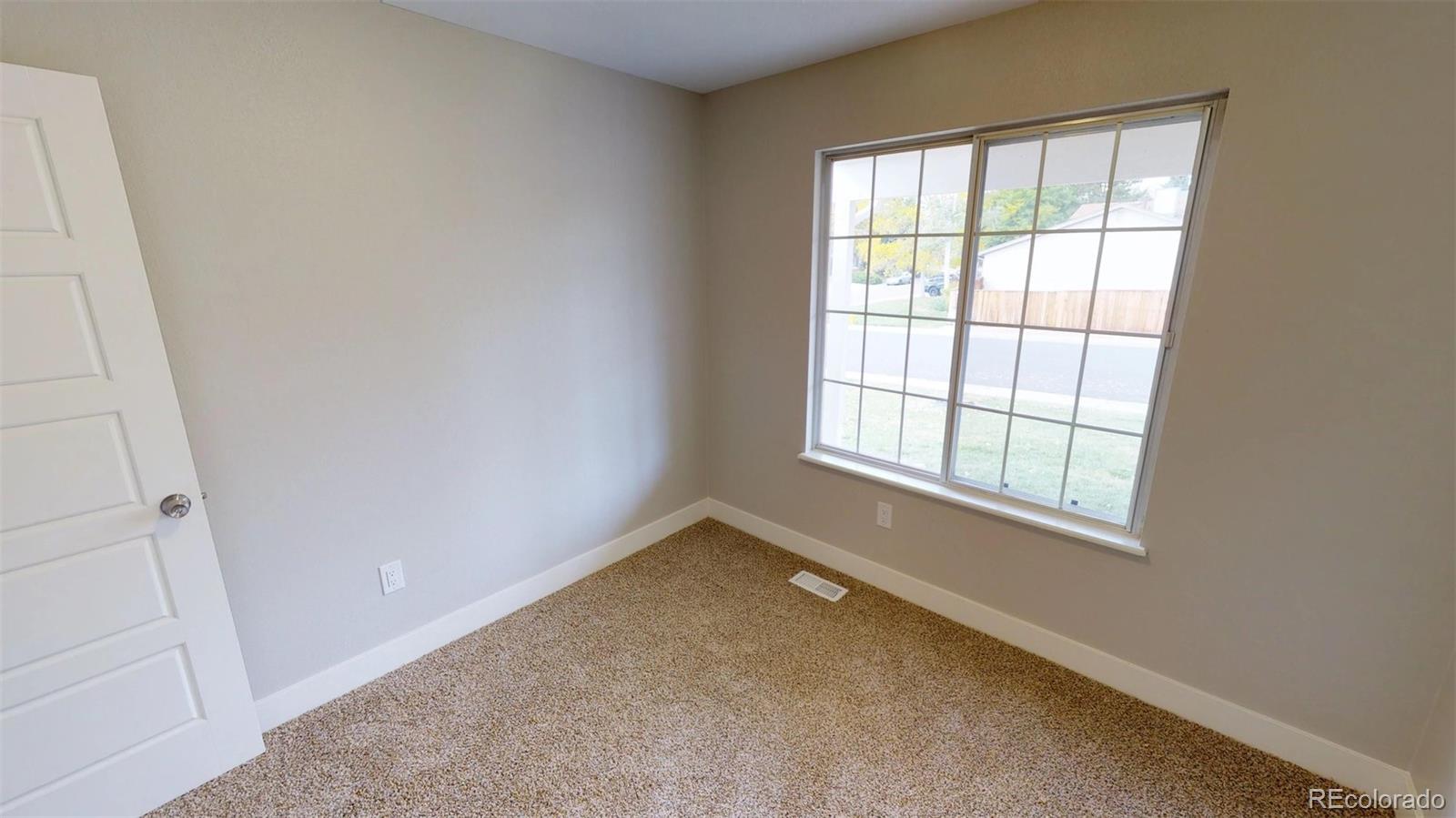 530 Prairie Ridge Road Highlands Ranch, CO 80126 - Photo 8 of 18 an empty room with a window