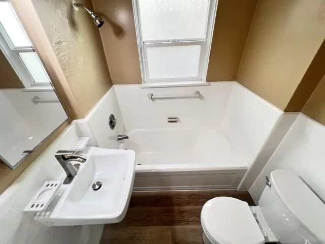 a bathroom with a sink and mirror