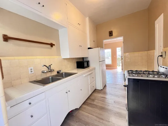 a kitchen with a sink and cabinets