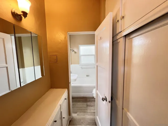 a bathroom with a bathtub and a shower