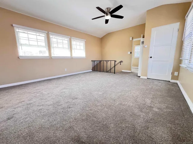 a big room with windows and closet