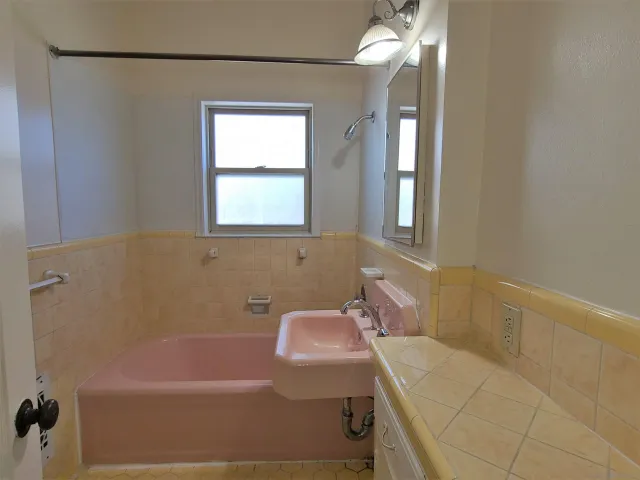 a bathroom with a sink and a bathtub
