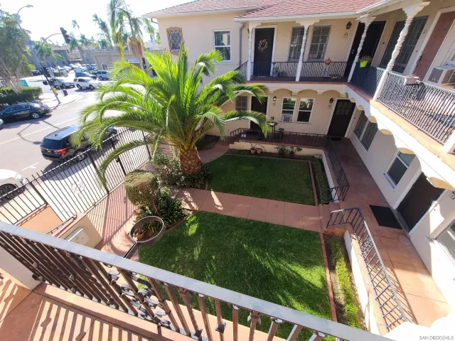 a view of a backyard with sitting area