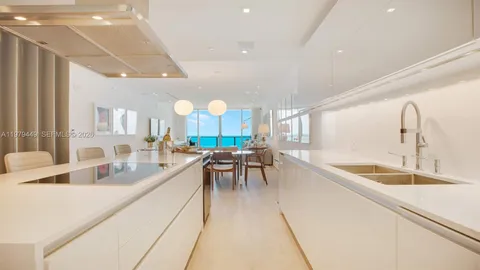 a very nice looking kitchen with a large counter space